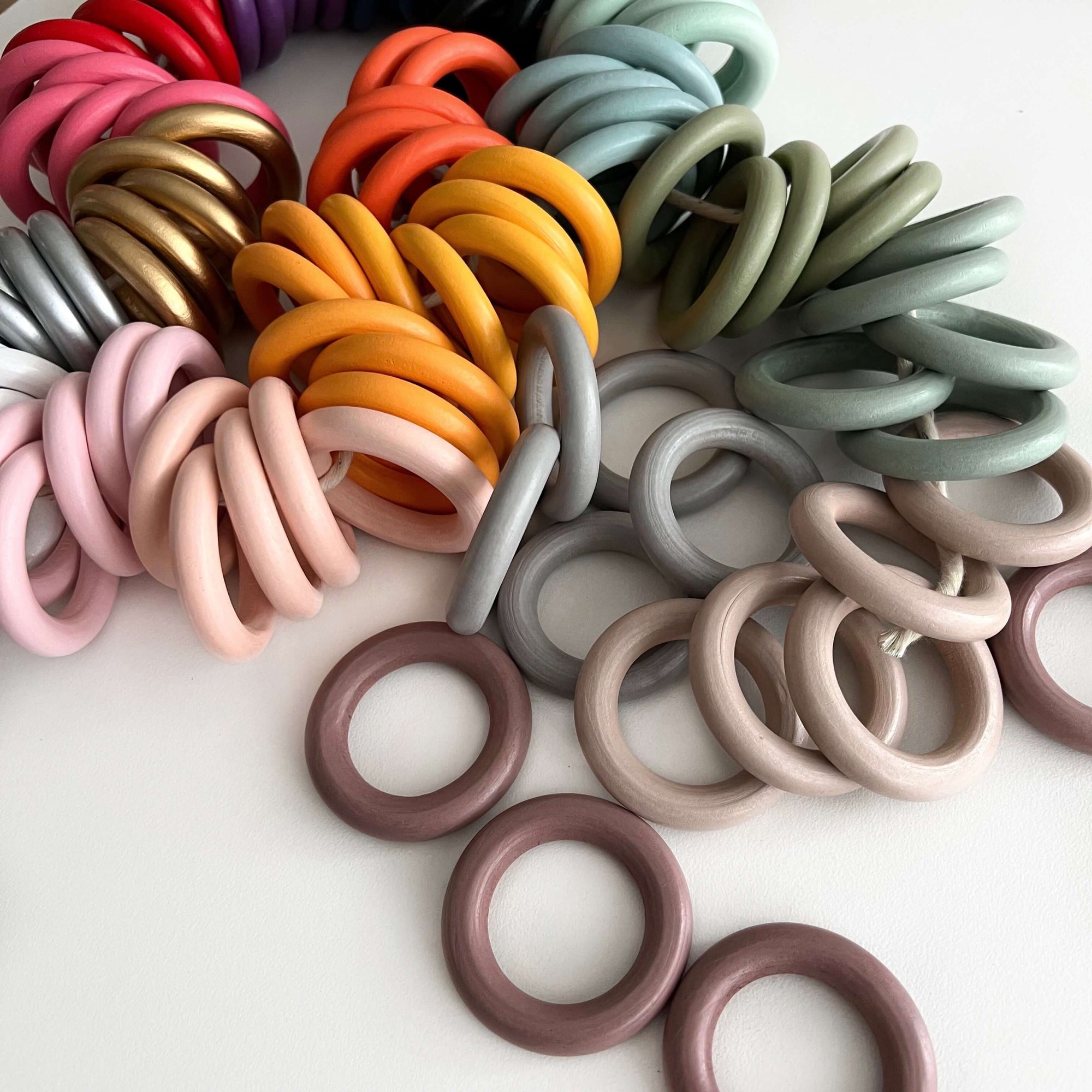 coloured wooden beads scattered on white desk