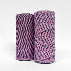 two cones of mixed macrame string in lavender skies colour shpwing a 1.5mm and 4mm variant on white back ground'