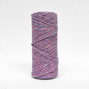 single roll of 4mm mixed string in lavender skies colourway standing upright on white background 