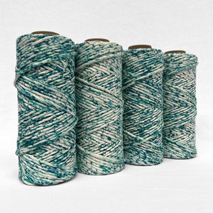 four rolls of blue lagoon colourway stnading side by side on angle on white back ground