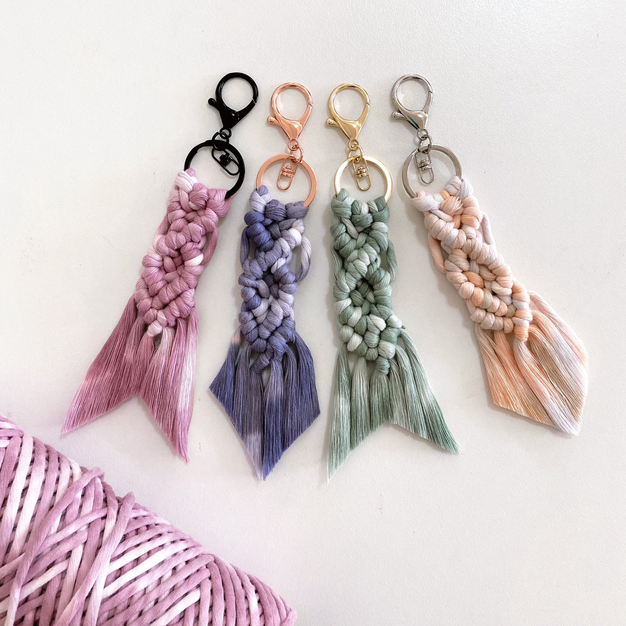 assorted metal keyring colours with macrame pattern attached